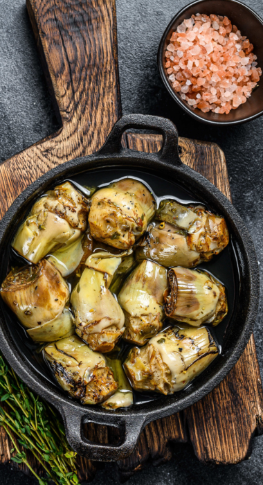 Canned artichokes in olive oil on a rustic wooden 2023 11 27 04 57 21 utc