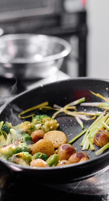 Cook frying vegetables on pan 2023 11 27 04 58 18 utc