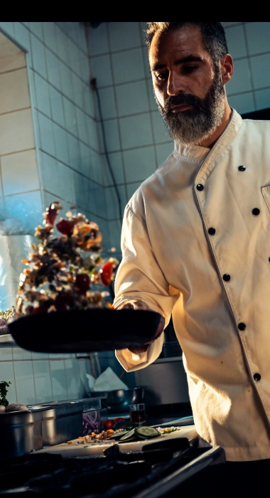 Chef cooking in a commercial kitchen